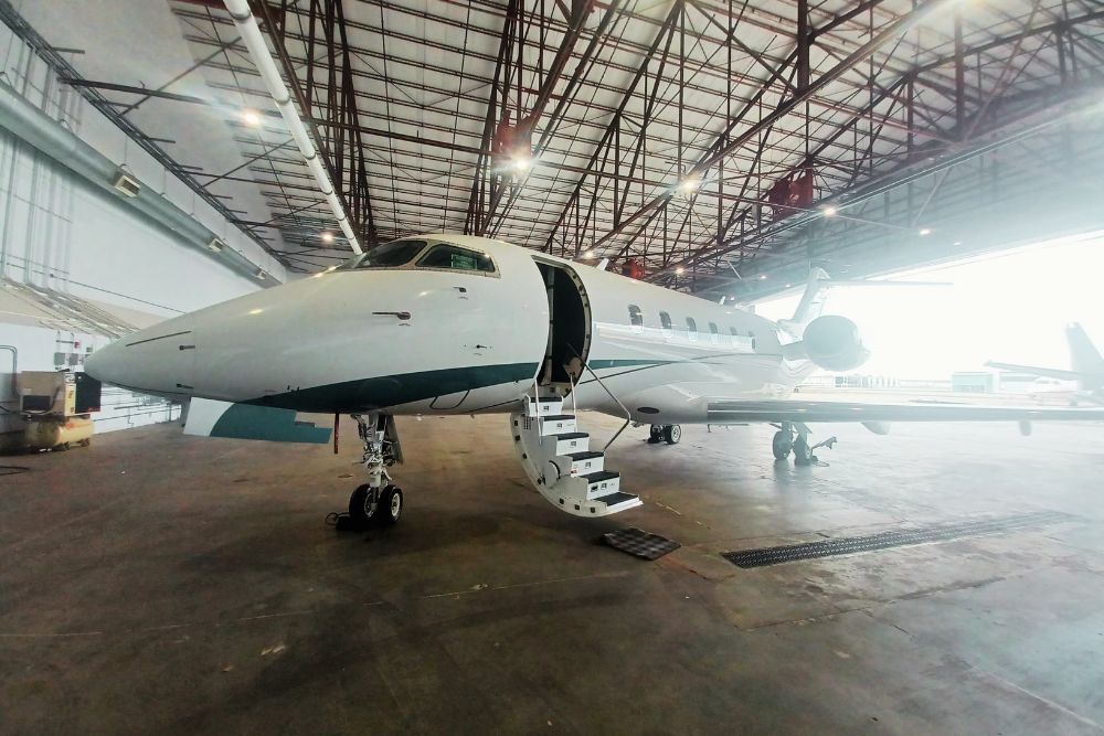 Chartright mid size jet in hanger