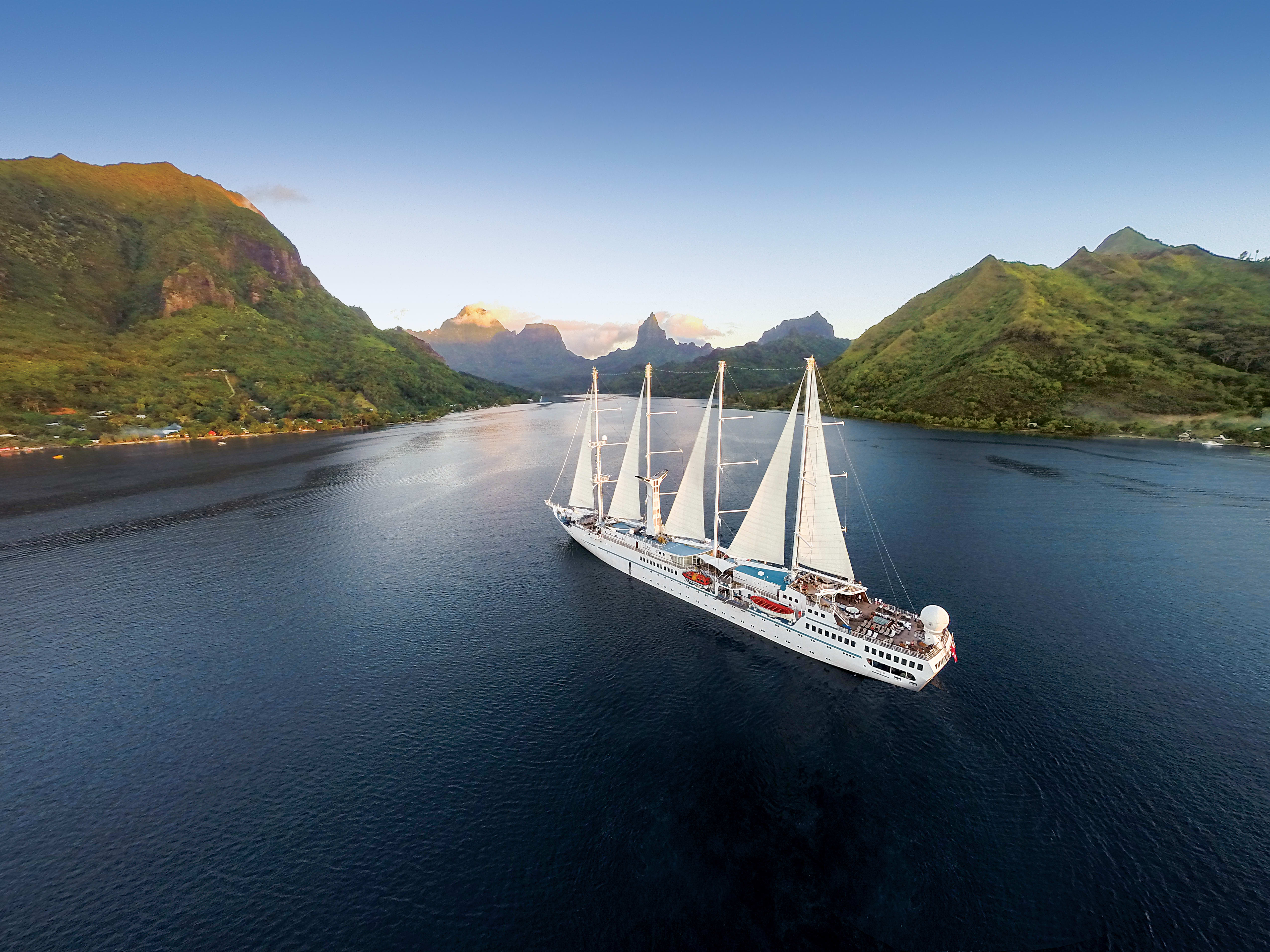 Windstar ship with sails up sailing the South Pacific