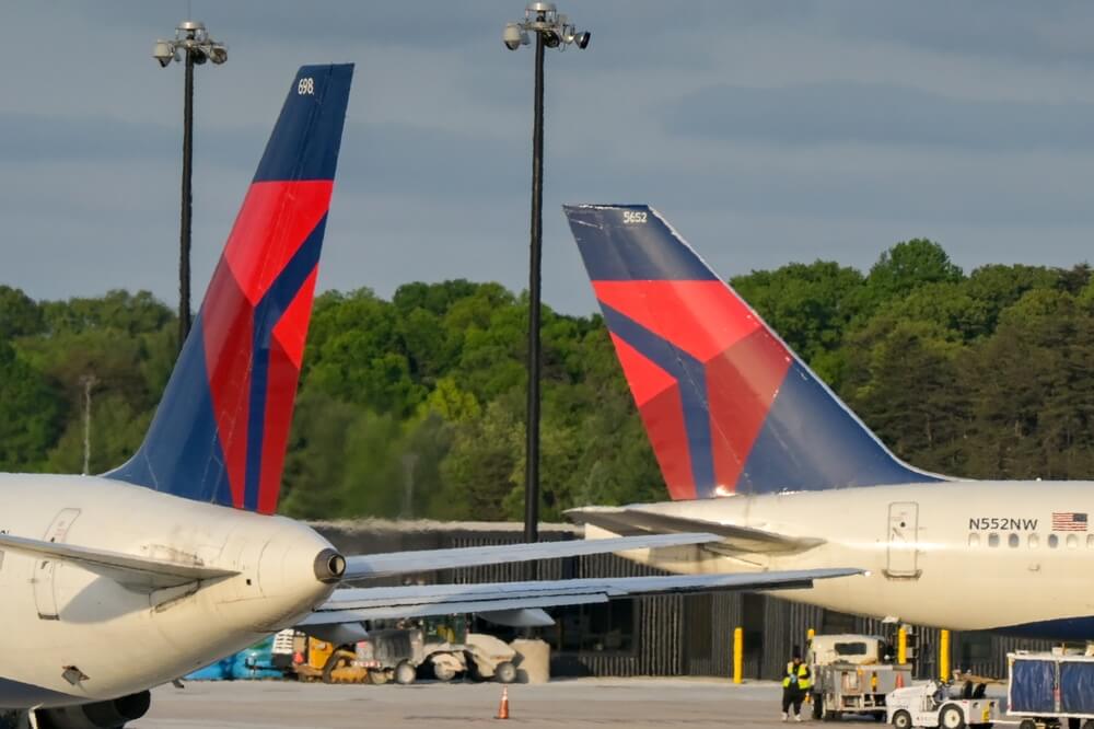 Two Delta Air Lines plane on runway in Minnesota