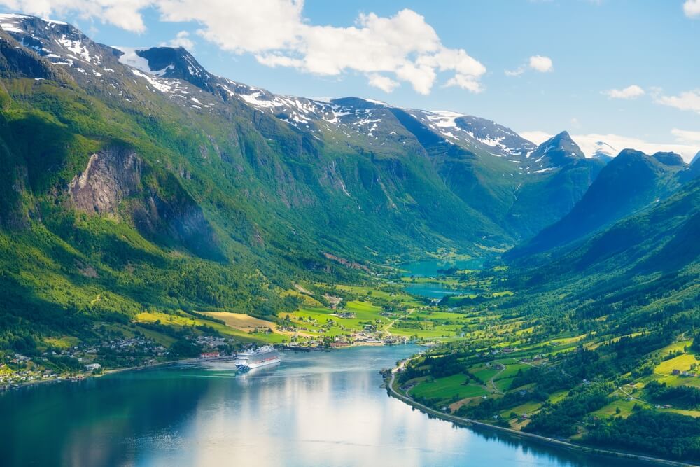 cruise ship sailing through Norwegian Fjords