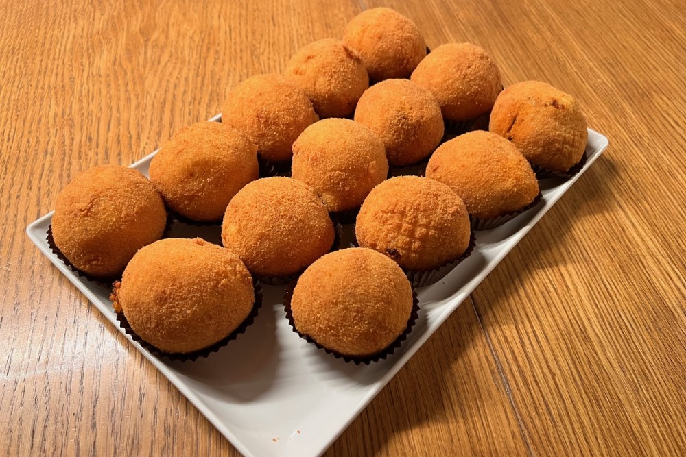 Traditional Sicilian delicacies include arancini rice balls stuffed with beef